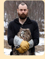 Photo: Blakiston's Fish-owl held by researcher