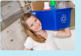 Photo: Girl with recycling bin