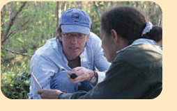 Photo: Dr. Steven Latta with Marisabel Paulino in the field